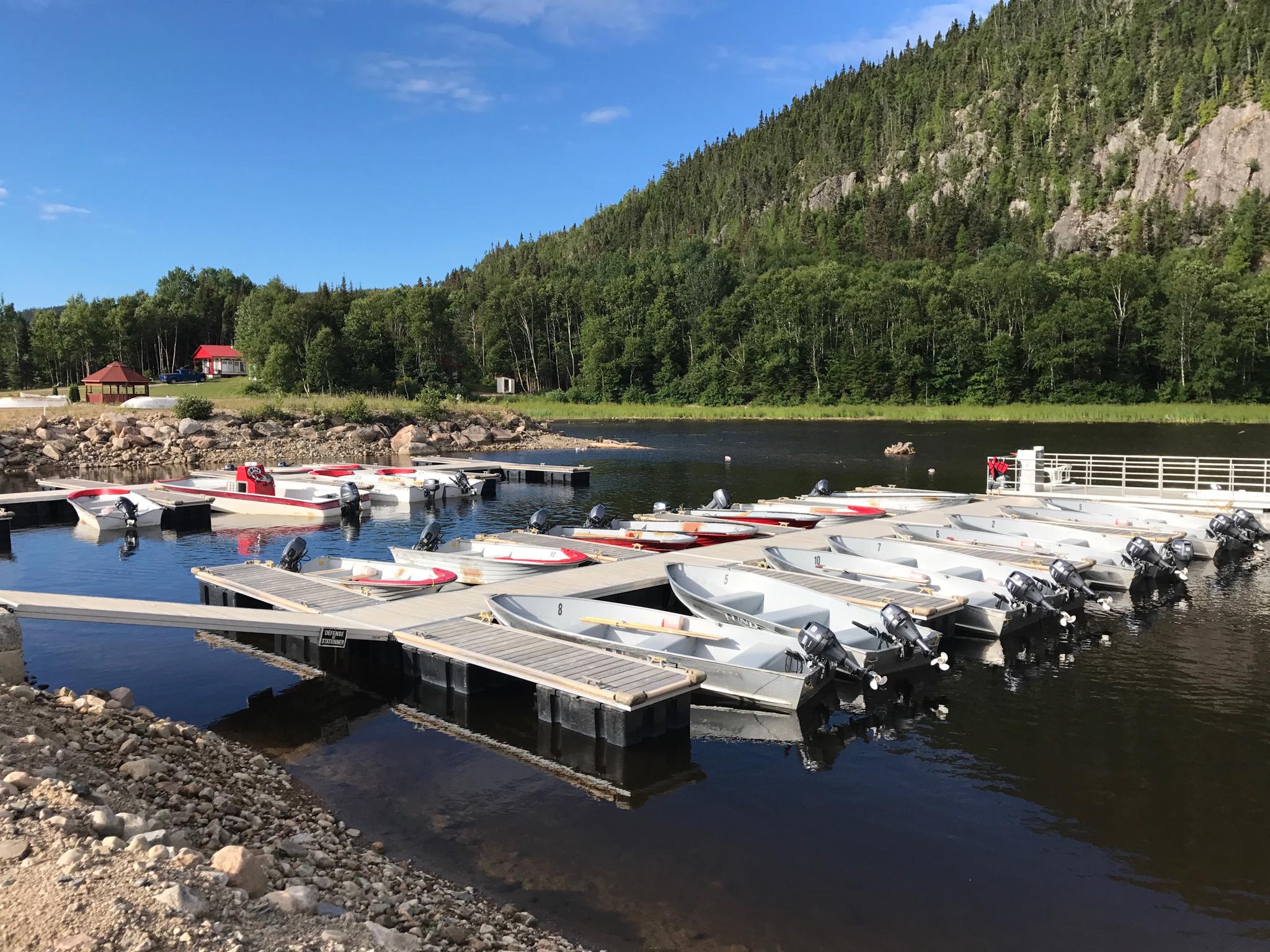 Angler showing off his catch at Pourvoirie Lacs des Sables et Paradis, Côte-Nord, Quebec