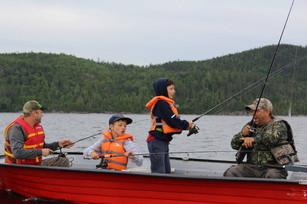 Guest proudly posing with his catch at Pourvoirie Lacs des Sables et Paradis, Côte-Nord, Quebec