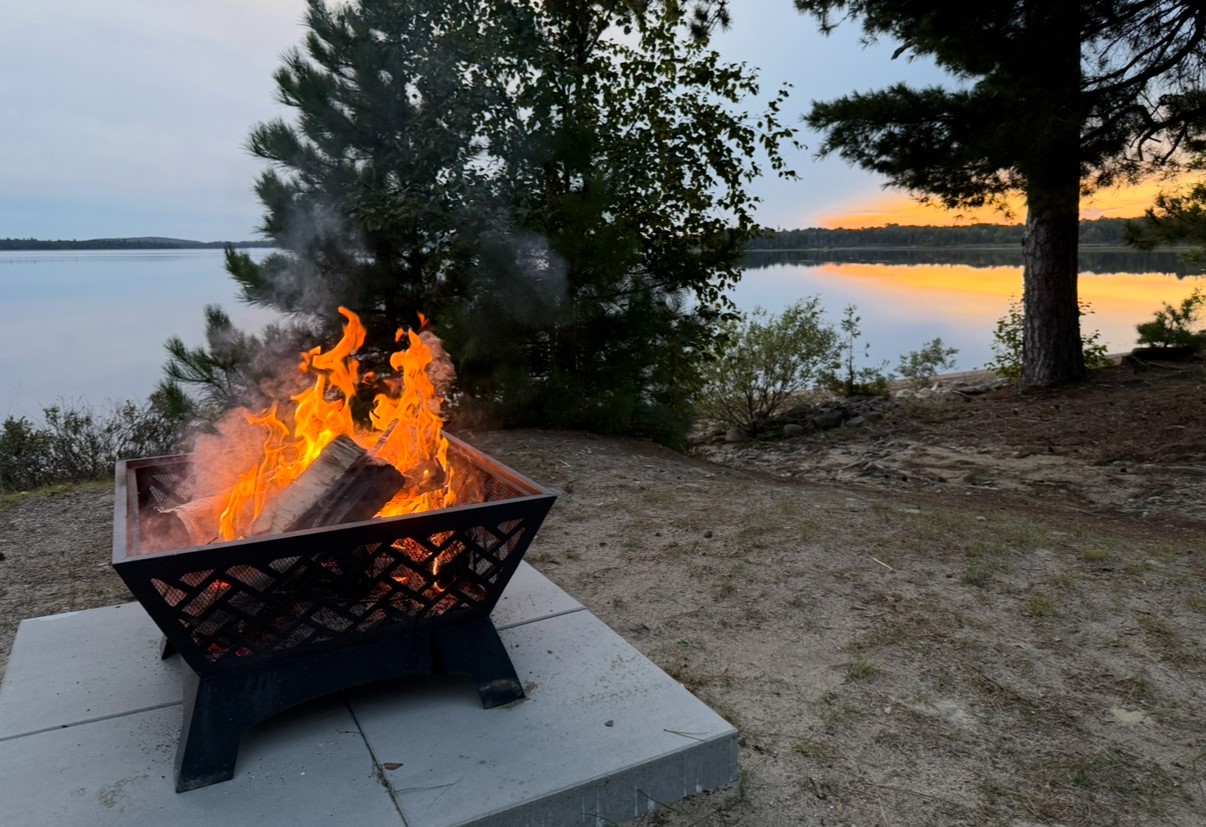 Outdoor fire pit in the evening at Camps Lac-aux-Sables, Abitibi-Témiscamingue, Quebec